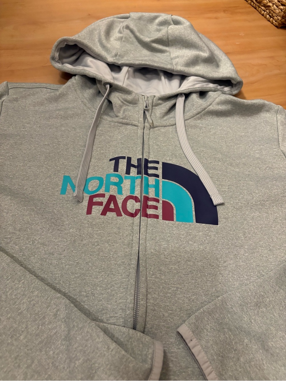 The North Face Light Gray Zip Hoodie with Teal, Navy & Burgundy Logo